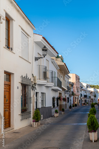 Fototapeta Naklejka Na Ścianę i Meble -  Streets of city of Alhaurin de la Tore, situated in south of Spain in Malaga province. Typically Andalusian small streets with white houses 