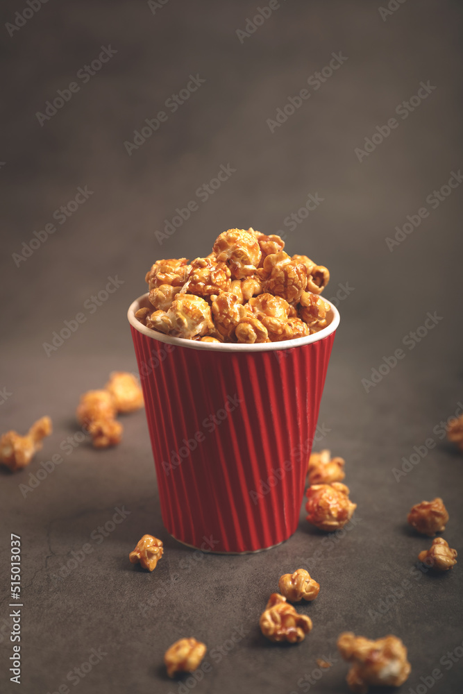 Delicious caramel popcorn in paper cups Delicious caramel popcorn in paper cups