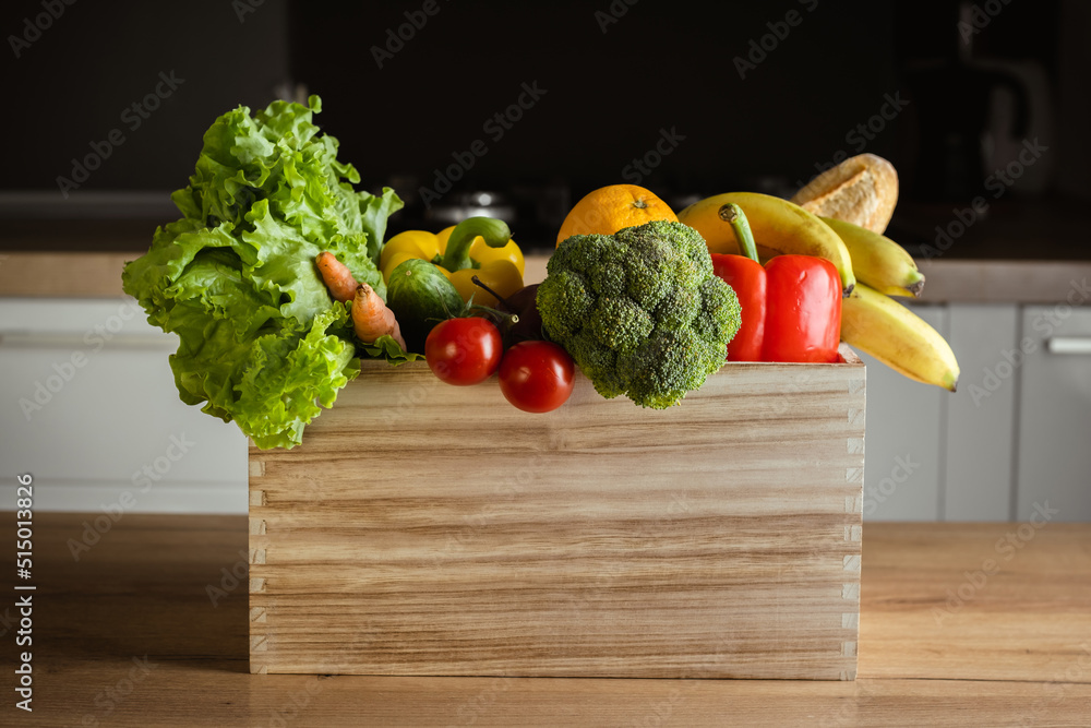 Grocery wooden box with fresh fruits and vegetables on modern kitchen ...