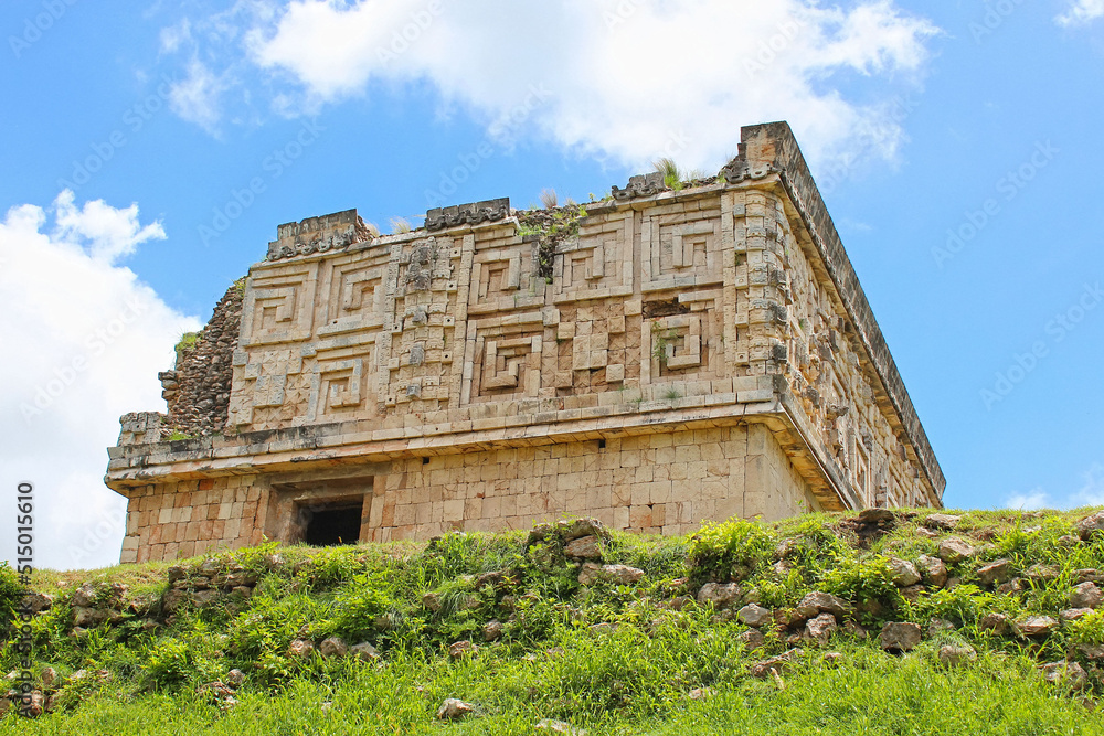Fototapeta premium Governor palace, territory of the Uxmal historical site, ancient city, representative of the Puuc architectural style, Yucatan peninsula, Mexico. Soft focus