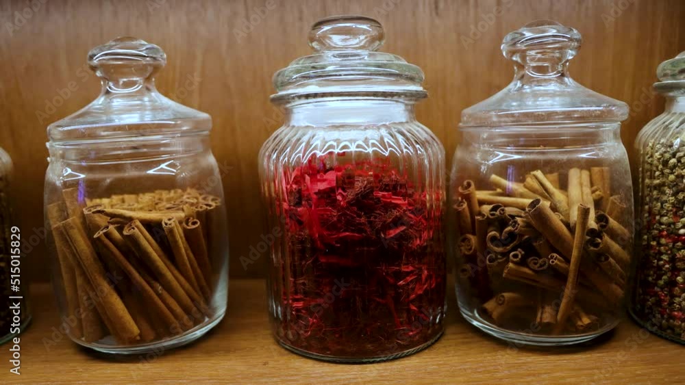 A glass jar with cinnamon quills in the kitchen, 4k video A glass jar with cinnamon quills in the kitchen, 4k video