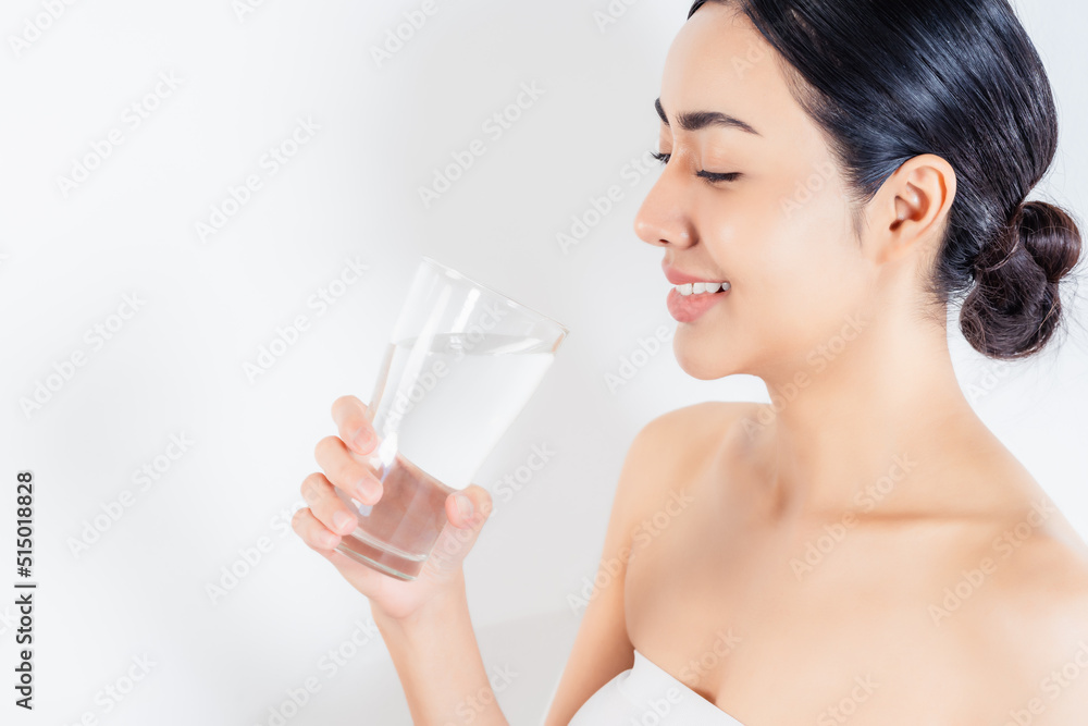 Healthy woman drinking water from a glass of water Beautiful asian girl holding a glass of pure water with happiness and smile face Health care Healthy lifestyle Skin care and Beauty Concept Healthy woman drinking water from a glass of water Beautiful asian girl holding a glass of pure water with happiness and smile face Health care Healthy lifestyle Skin care and Beauty Concept