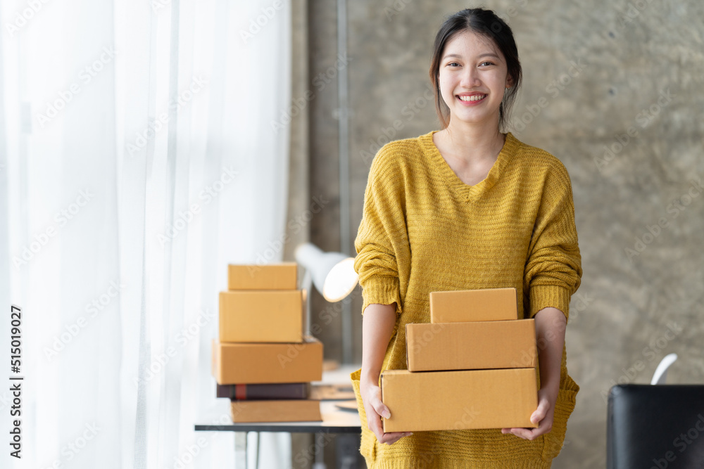 Starting small businesses SME owners female entrepreneurs check online orders to prepare to pack the boxes, sell to customers, sme business ideas online. Starting small businesses SME owners female entrepreneurs check online orders to prepare to pack the boxes, sell to customers, sme business ideas online.