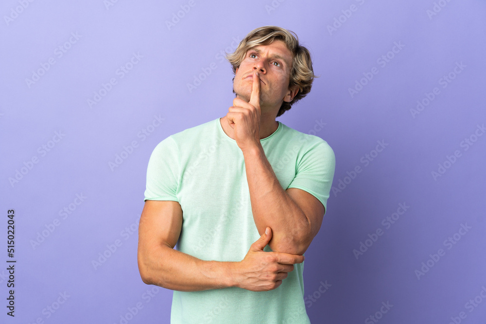 English man over isolated purple background having doubts while looking up English man over isolated purple background having doubts while looking up