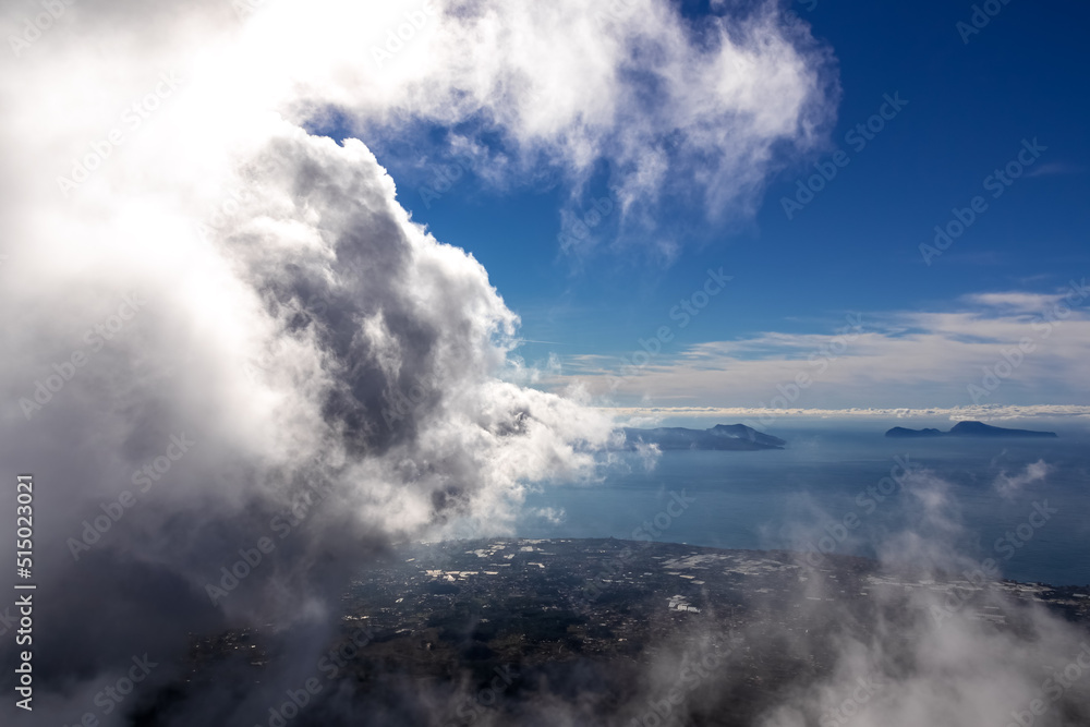 Panoramic view from volcano Mount Vesuvius on the bay of Naples, Province of Naples, Campania region, Italy, Europe, EU. Looking at the island of Capri and Mediterranean coastline on a cloudy day.