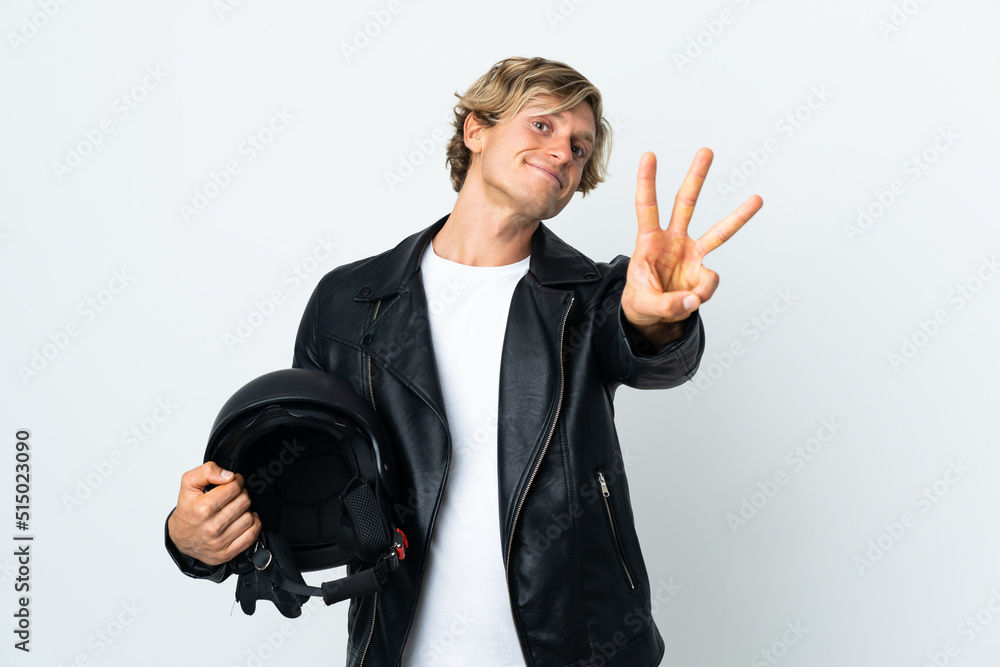 English man holding a motorcycle helmet happy and counting three with fingers English man holding a motorcycle helmet happy and counting three with fingers