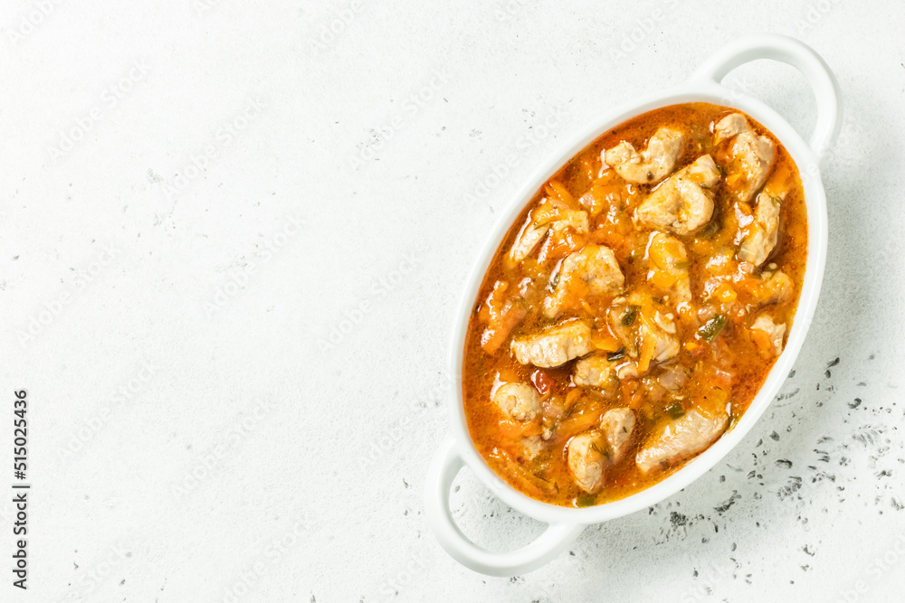 Vegetable chicken goulash in pot. Top view, copy space. Vegetable chicken goulash in pot. Top view, copy space.