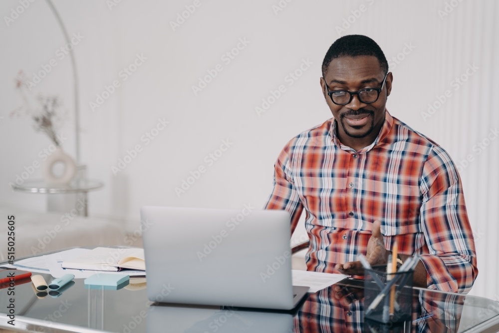 Puzzled african american man look at laptop screen. Poor internet connection. Problem at remote work Puzzled african american man look at laptop screen. Poor internet connection. Problem at remote work