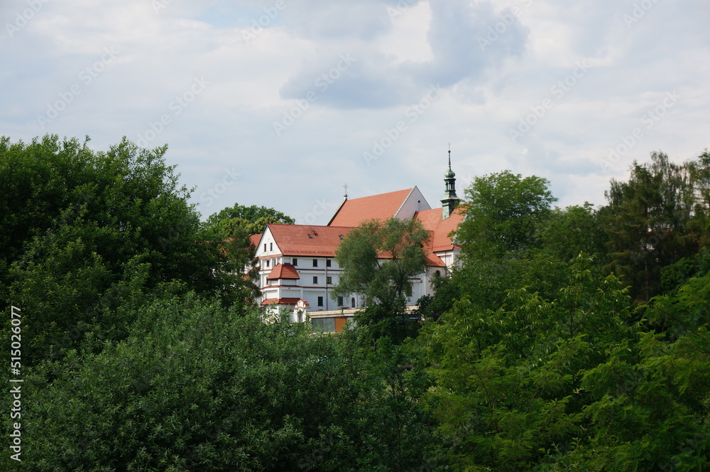 Franciscan monastery in the distance among the greenery. Wieliczka, Poland.