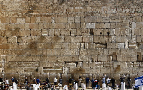 Notes in the Wailing Wall in Jerusalem with their requests and desires addressed to God. photo