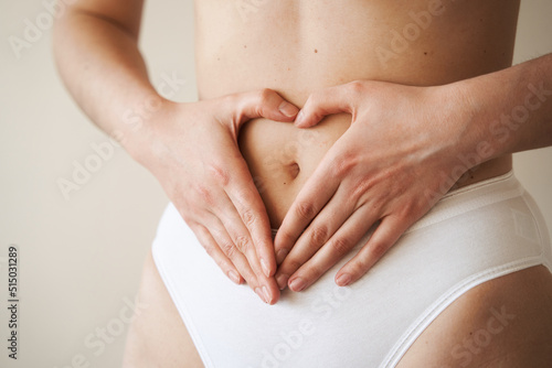 Maternity. Pregnant woman in early pregnancy period. Girl touching her tummy. Waiting for baby. Pregnancy.