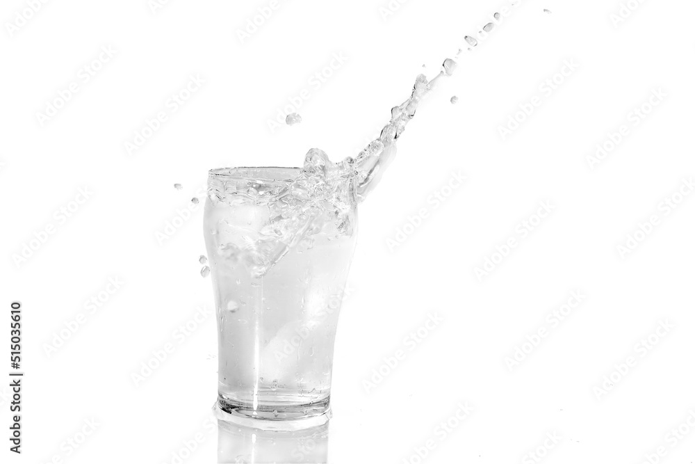 Ice cubes falling in a glass of cold fresh water Ice cubes falling in a glass of cold fresh water