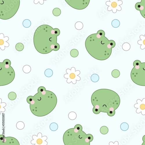 Seamless pattern of frog faces, flowers and dots on a green background.