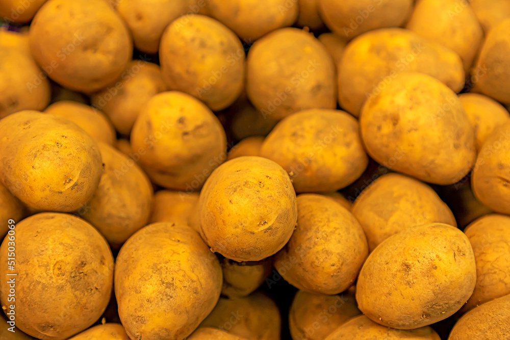 New potato tubers, background texture of fresh vegetables