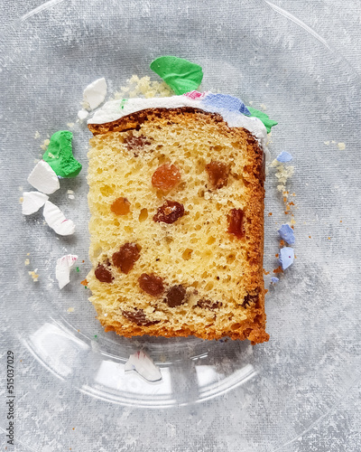 A piece of Easter cake with raisins on the table on a plate