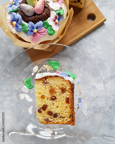A piece of Easter cake with raisins on the table on a plate