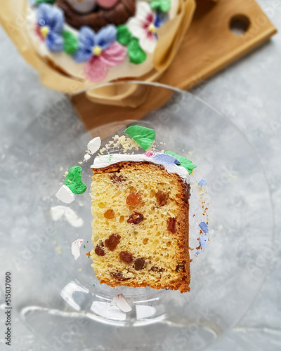 A piece of Easter cake with raisins on the table on a plate