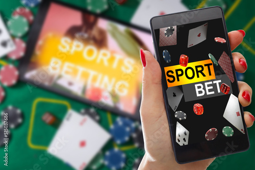 Print op canvas inscription your bet wins on a smartphone on the poker table
