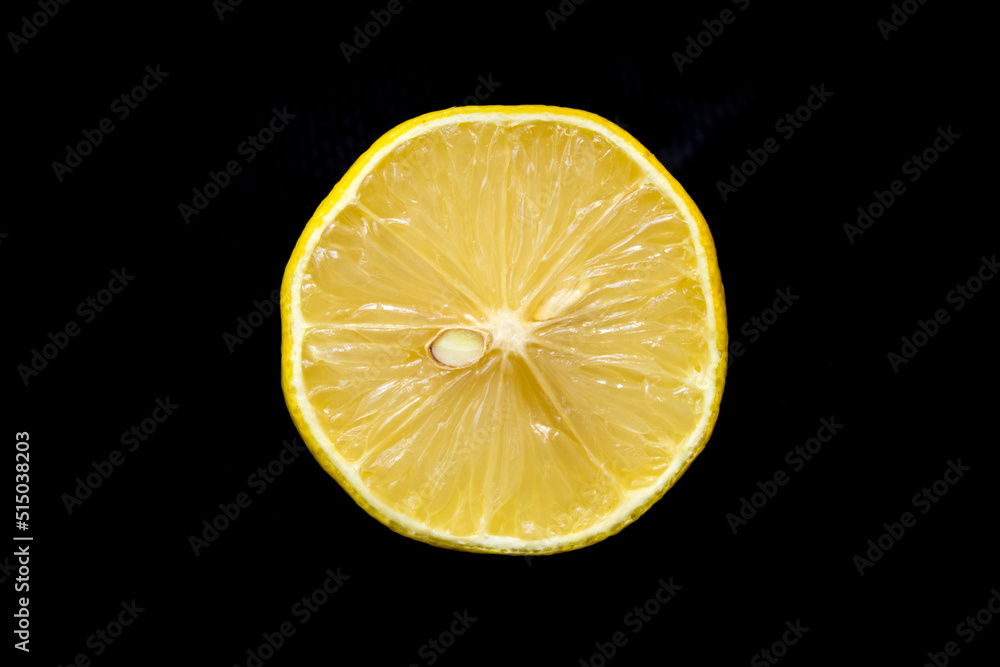 sliced lemon lies on a black background sliced lemon lies on a black background