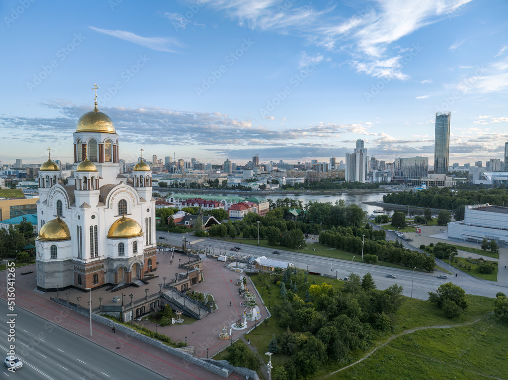 Summer Yekaterinburg and Temple on Blood in cloudy sunset. Aerial view of Yekaterinburg, Russia. Translation of the text on the temple: Honest to the Lord is the death of His saints.