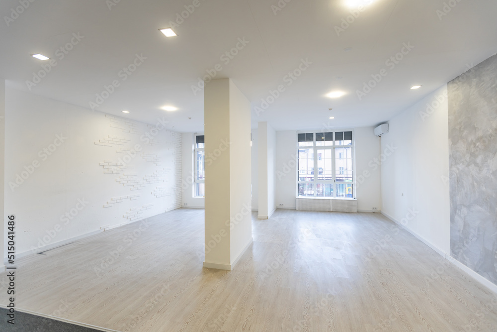 Sunny spacious hangar area with concrete floor and windows in floor. Sunny spacious hangar area with concrete floor and windows in floor.