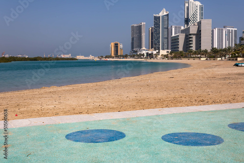Beach walk at Al Reem island in Abu Dhabi, modern skyscrapers in the background © Blazenka