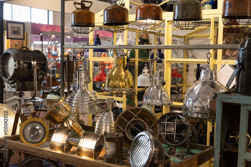 Display of Antique Large Lamps, Lighthouses and Vintage Metal Projectors