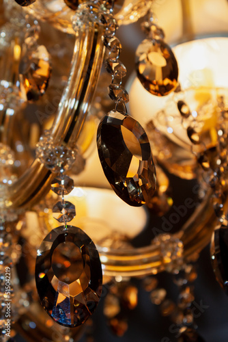 Elements of hanging crystal chandelier close-up.... © glebchik
