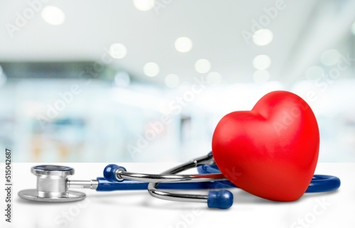 Red heart shape hand exercise ball with doctor physician's stethoscope. World heart health day. doctor day, world hypertension day