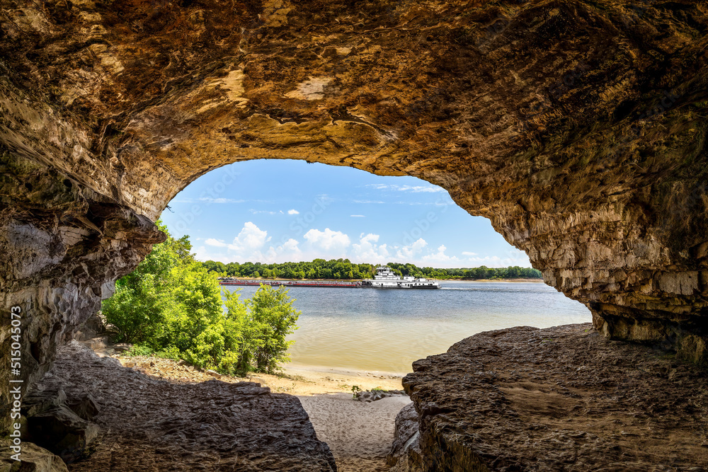 An Ohio River barge is viewed from Cave-In-Rock, a natural cavern and main attraction of its namesake Illinois state park. The cave, in a limestone bluff, is said to have been a pirates’ hideout.