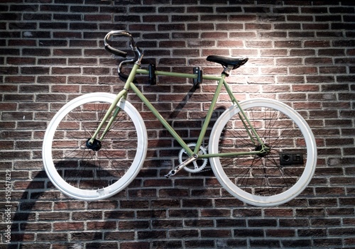 A bicycle on the on a bricked wall