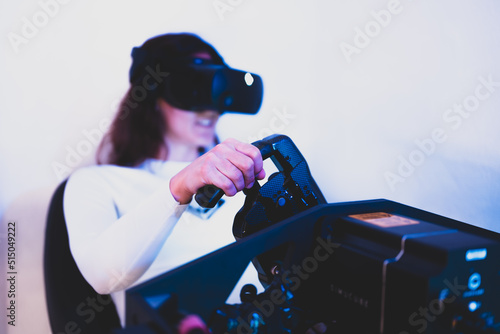A gamer woman is sim racing with a high end simracing reck