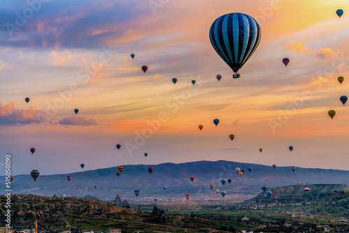 Low light scenery of Hot air balloon flying over spectacular Cappadocia
