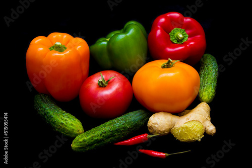 colorful healthy vegetables lie on a black background