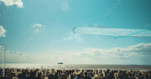 RAF Red Arrows aerobatics airshow display in blue sky