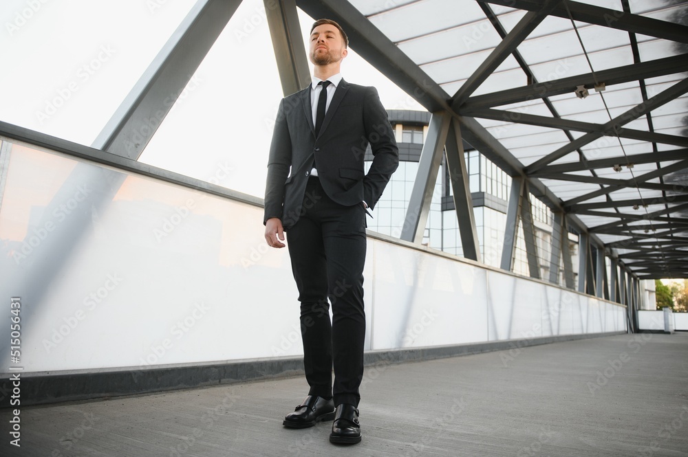 Portrait of an handsome businessman in an urban setting Portrait of an handsome businessman in an urban setting