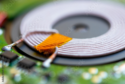 wireless charger disassembled from the inside, wireless charging induction coil photo