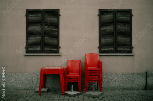 red chairs in front of a wall