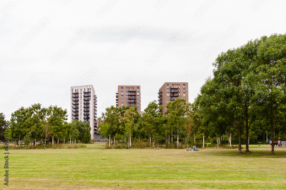 New block of modern apartments with balconies a adjacent to Thames Barrier Park, Silvertown, London,  England, June 19, 2022
