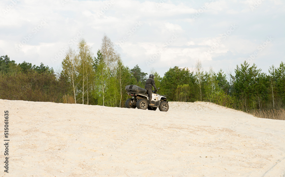 Fototapeta premium Atv freeriding in sand quarry, extreme sport