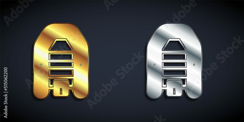 Gold and silver Inflatable boat with outboard motor icon isolated on black background. Long shadow style. Vector