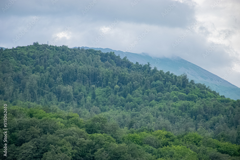 Naklejka premium clouds over the mountain