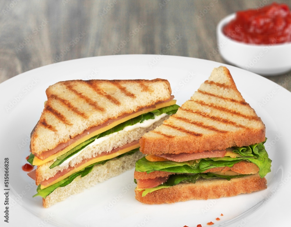 Tasty fresh sandwich with sauce on the table. Tasty fresh sandwich with sauce on the table.