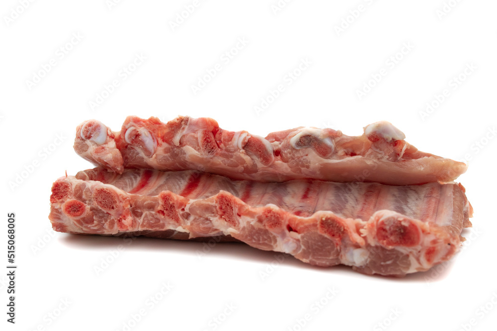 Two pieces of raw pork ribs. Isolated on white background. Highly demanded meat for barbecues.