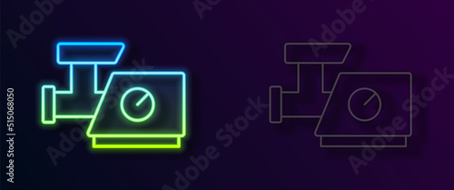 Glowing neon line Kitchen meat grinder icon isolated on black background. Vector