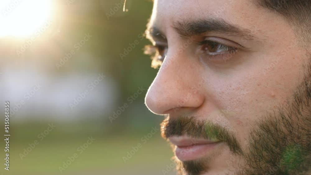 Macro portrait of young caucasian bearded man opening his closed eyes. Male beautiful brown eyes looking at camera. Confident guy with attractive and deep sight Macro portrait of young caucasian bearded man opening his closed eyes. Male beautiful brown eyes looking at camera. Confident guy with attractive and deep sight