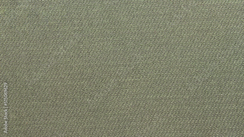 green background from a textile material. Fabric with natural texture. Backdrop