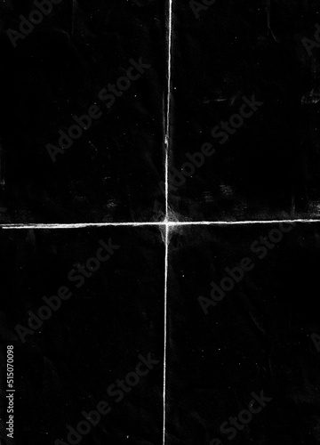 Folded paper with grungy texture in black background. can be used to replicate the aged and worn look for your creative design. old paper for photo texture overlay in retro style