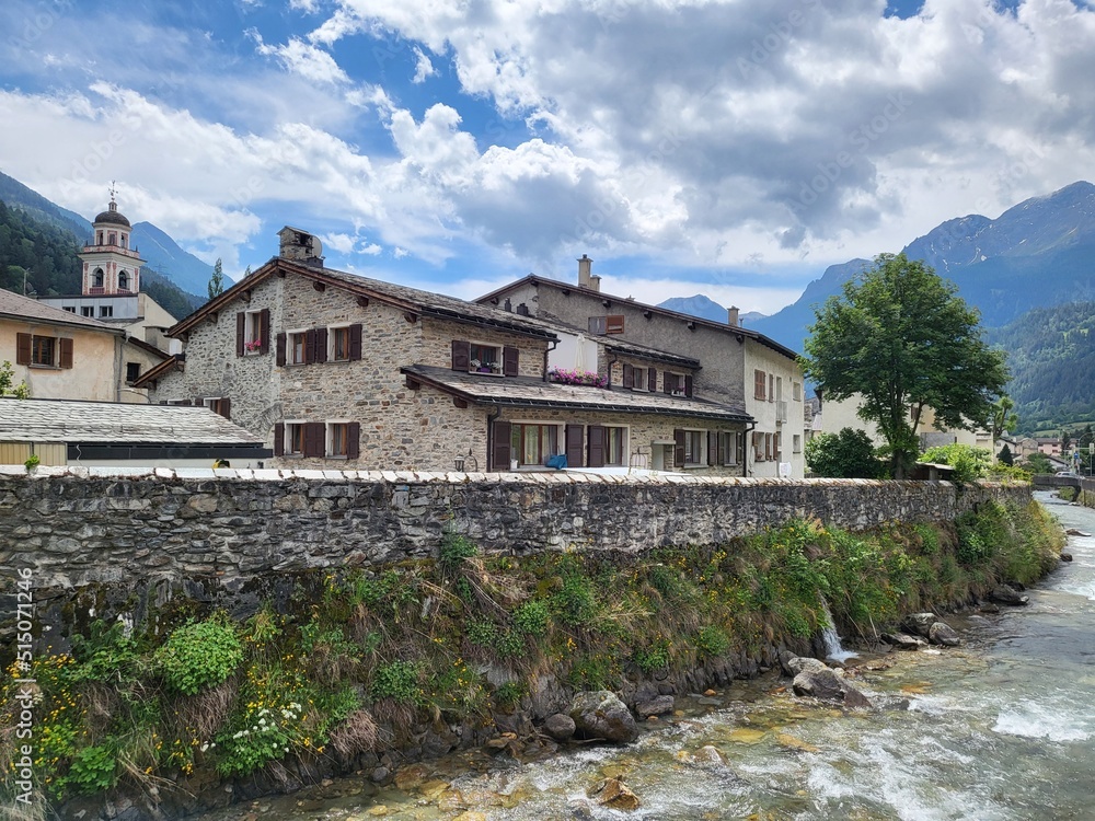 House on the river in historical Poschiavo town in Canton Graubunden, Switzerland. House on the river in historical Poschiavo town in Canton Graubunden, Switzerland.