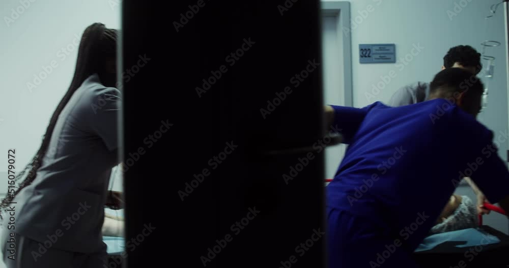 Medical personnel transport an urgent patient to the emergency room Medical personnel transport an urgent patient to the emergency room